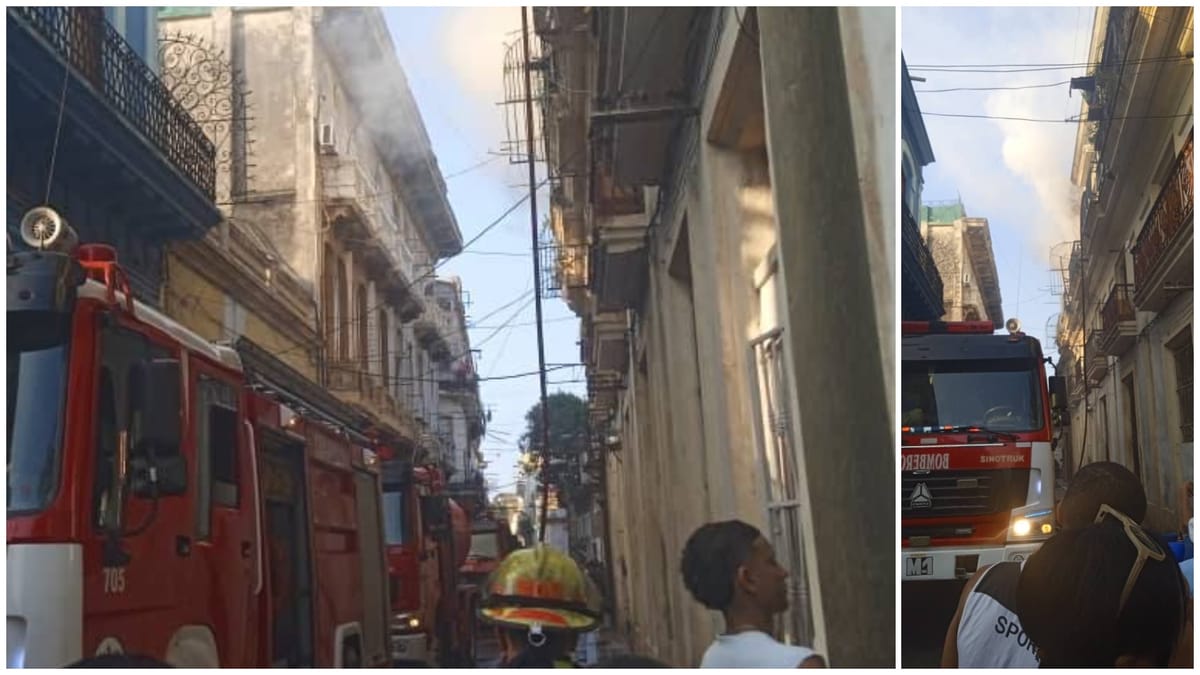 Bomberos actuando en calle estrecha con edificios antiguos