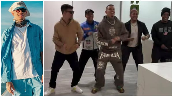 Hombre sonriente y grupo bailando alegremente