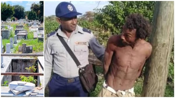 Agente de policía hablando con hombre junto a poste