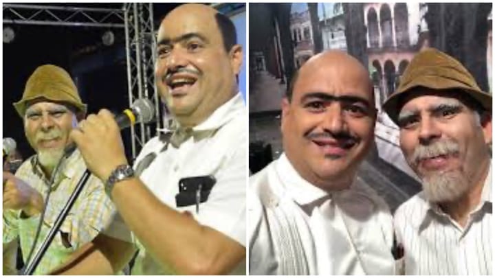 Dos hombres sonrientes en un escenario.