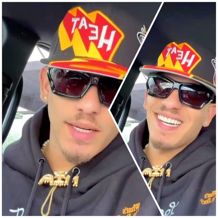 Hombre sonriente con gorra y gafas de sol