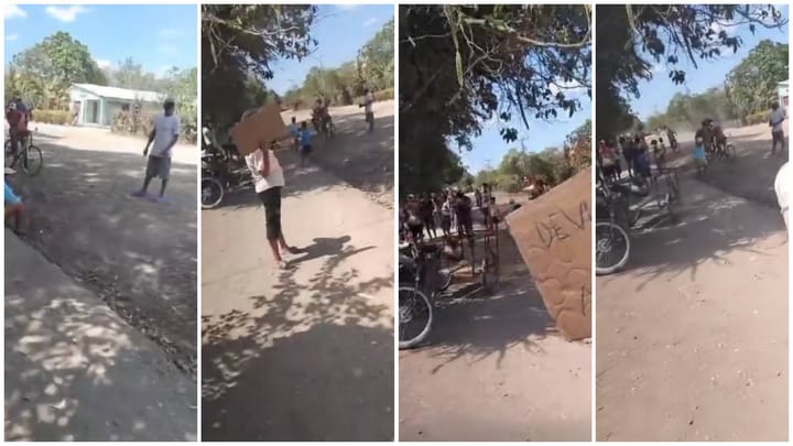 Grupo de personas con bicicletas en camino rural.